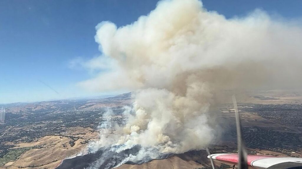 In an undated image provided by Cal Fire SCU, the Little fire in Northern California. A 700-acre fire was spreading on Tuesday, July 21, 2026, in the parched hills of the San Francisco Bay Area, prompting evacuation orders for thousands of residents, according to fire officials. (Cal Fire SCU via The New York Times)