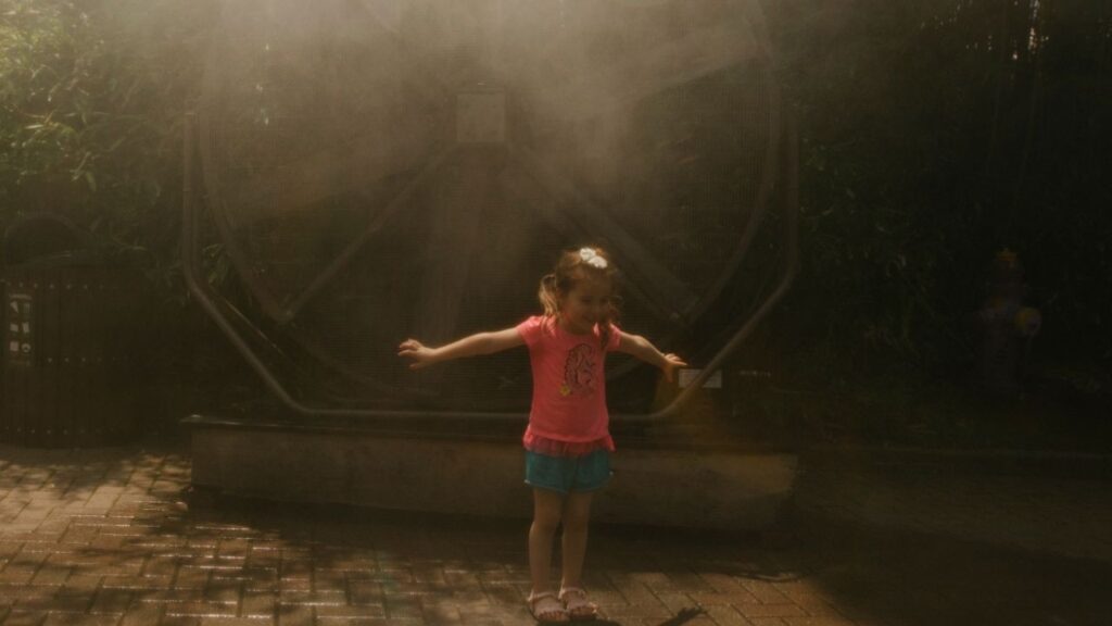 Magnolia Stuhmer, 4, plays in misters at the Cincinnati Zoo in Cincinnati, Ohio, on Thursday, July 2, 2026. Temperatures in parts of the Northeast reached triple digits by midday as the region slogged through a hot spell that has already scorched the Midwest. (Madeleine Hordinski/The New York Times)