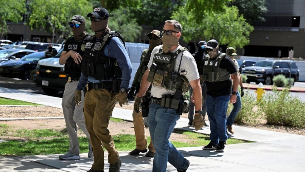 Masked law enforcement officers, including HSI and ICE agents, walk into an immigration court in Phoenix, Arizona, U.S., May 21, 2025. (Reuters File)