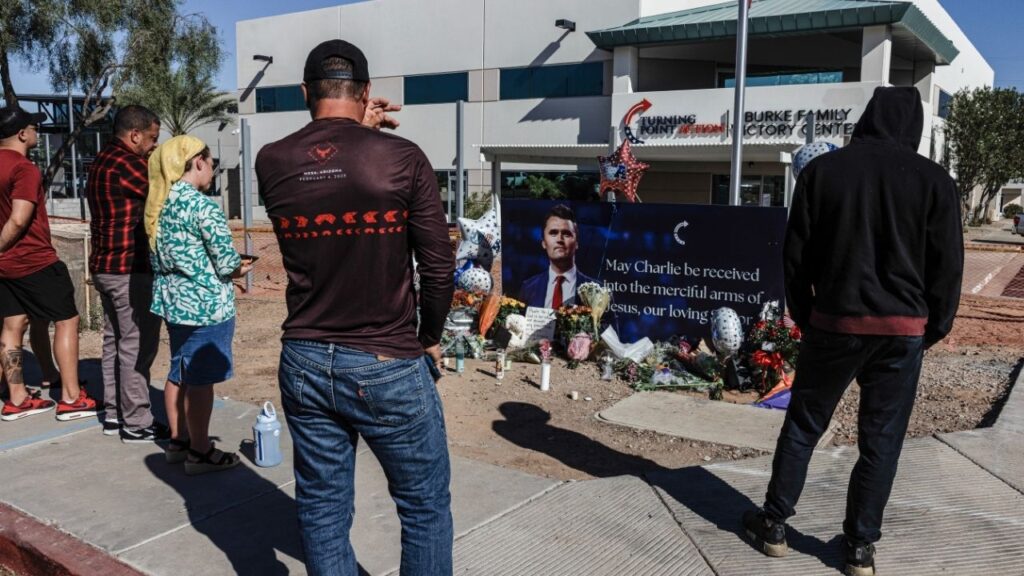 People at a makeshift memorial for Charlie Kirk outside the Turning Point USA headquarters in Scottsdale, Ariz., on Thursday, Sept. 11, 2025, the day after he was fatally shot at a campus event in Utah. Nearly 10 months after the assassination of Kirk, prosecutors will begin laying out their case on Monday, July 6, in a hearing that will put Kirk’s parents and widow in the same courtroom as the man charged with murdering the conservative activist. (Adriana Zehbrauskas/The New York Times)