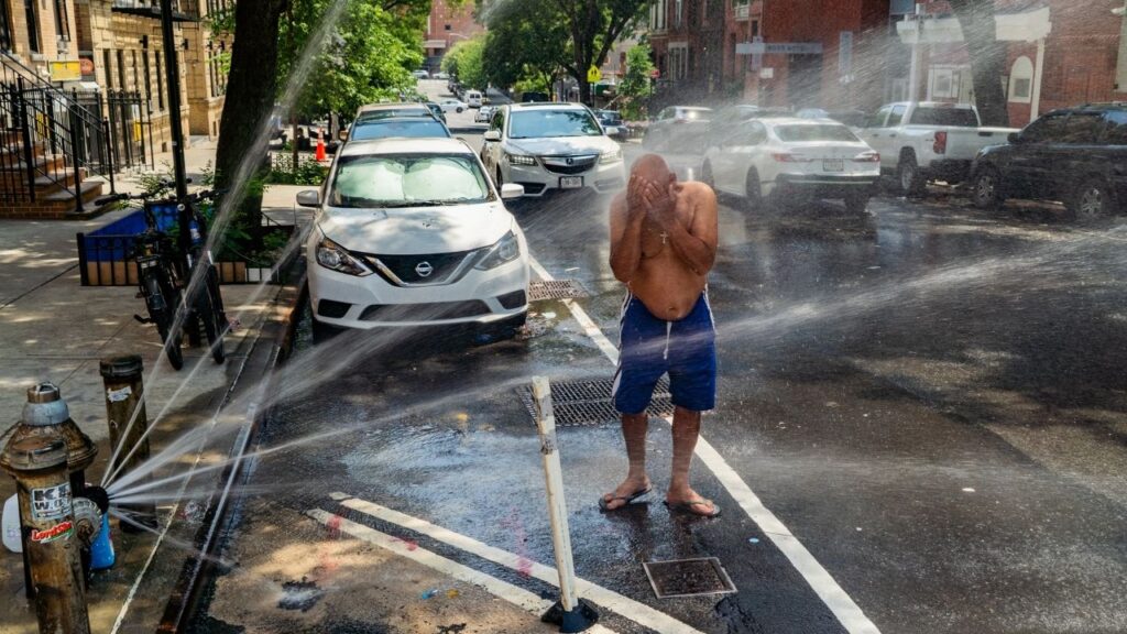 People find relief from the high heat and humidity in New York, June 30, 2026. More than 160 million people are under extreme heat warnings or heat advisories ahead of the Fourth of July weekend. (Madison Swart/The New York Times)