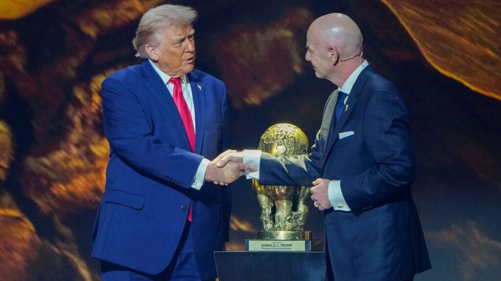 President Donald Trump accepts the first FIFA Peace Prize from Gianni Infantino, right, the president of FIFA, during the draw for the 2026 FIFA World Cup, at the Kennedy Center in Washington, Dec. 5, 2025. President Trump called Infantino and asked him to review the suspension of the United States’ top goal scorer, Folarin Balogun, after he was given a red card in the team’s match that night against Bosnia and Herzegovina, according to three people familiar with the conversation. (Tierney L. Cross/The New York Times)