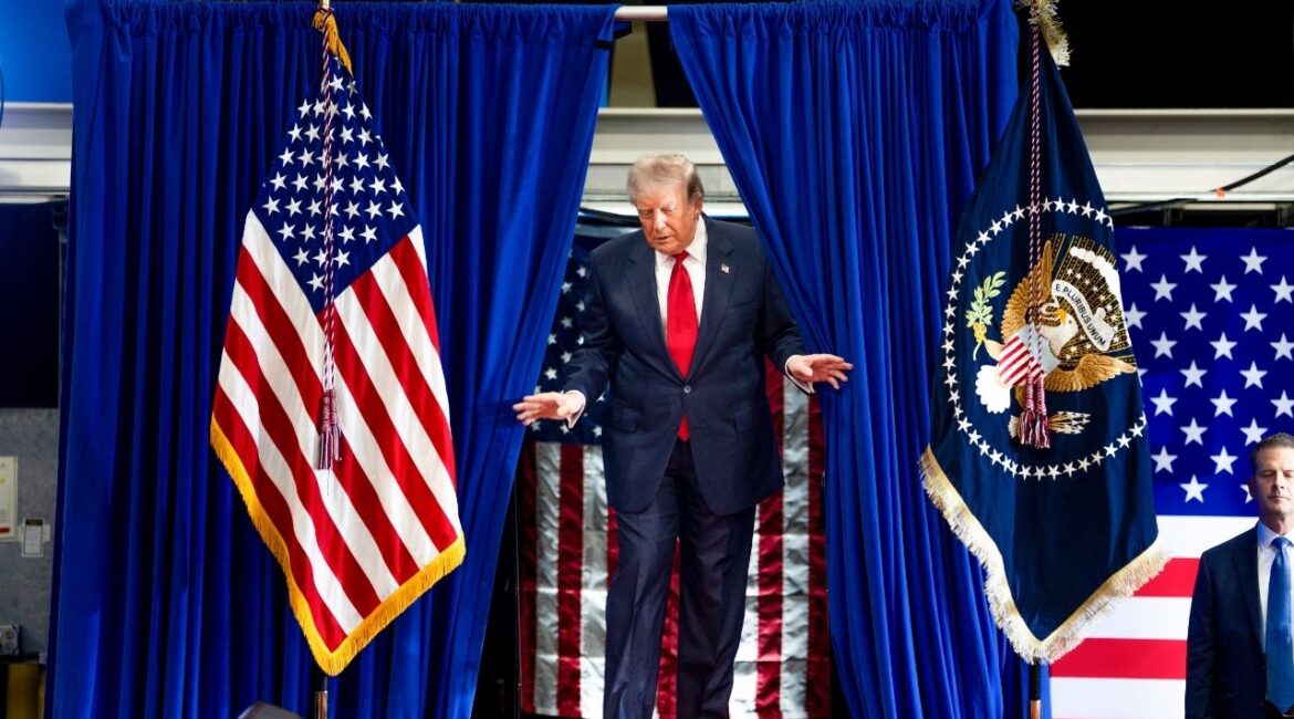 President Donald Trump takes the stage to deliver remarks at the General Motors Proving Ground in Milford, Mich., July 27, 2026. The sanctions legislation that moved forward in the Senate this week goes beyond enacting new financial restrictions on Russia and Iran. It would also give Trump broad new powers to impose tariffs on imports from some of the world’s largest economies. (Doug Mills/The New York Times)