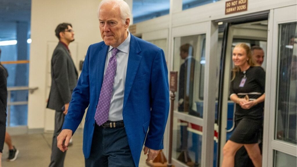 Sen. John Cornyn (R-Texas) walks out of the Senate subway on Capitol Hill in Washington on Thursday, July 30, 2026. Standing in the way of Todd Blanche, President Trump’s choice for attorney general, a liberated Senator Cornyn is wielding his leverage. (Alex Kent/The New York Times)