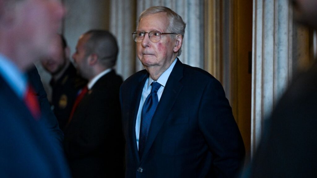 Sen. Mitch McConnell, (R-Ky.) stands outside the Senate Chamber at the Capitol in Washington, Jan. 8, 2026. The Republican senator denied that he had suffered a heart attack and said he had left the hospital and moved to a physical rehabilitation center. He did not give a timetable for returning to Capitol Hill. (Kenny Holston/The New York Times)