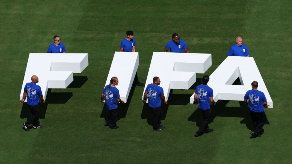 Soccer Football - FIFA World Cup 2026 - Final - Spain v Argentina - New York/New Jersey Stadium, East Rutherford, New Jersey, U.S. - July 19, 2026 Pitch staff carry the FIFA logo on the pitch before the match REUTERS/Mike Segar