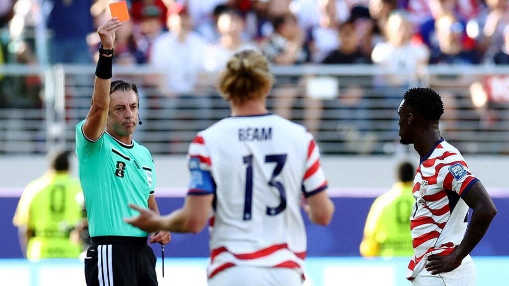 Soccer Football - FIFA World Cup 2026 - Round of 32 - United States v Bosnia and Herzegovina - San Francisco Bay Area Stadium, Santa Clara, California, U.S. - July 1, 2026 Folarin Balogun of the U.S. is shown a red card by referee Raphael Claus REUTERS/Phil Noble/File Photo