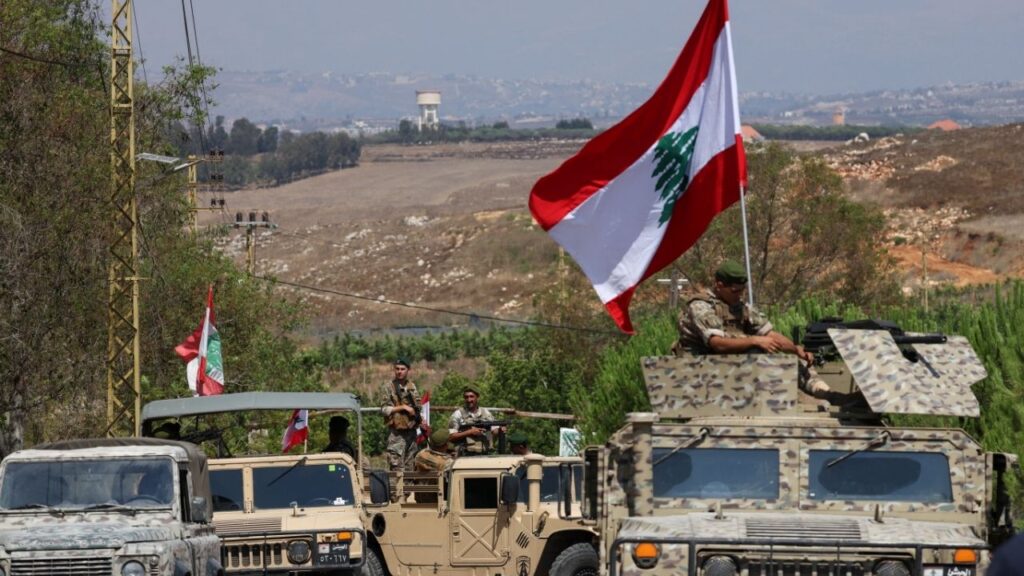 Soldiers wait at the entrance of Zawtar al-Gharbiyeh village, southern Lebanon, as Lebanese troops deploy in the area following the withdrawal of Israeli forces under a U.S.-brokered plan, July 21, 2026. (Reuters/Zohra Bensemra)