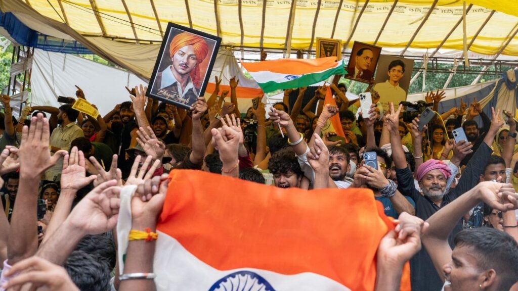 Supporters of the Cockroach Janta Party celebrate the resignation of India’s education minister in New Delhi on Saturday, July 25, 2026. The resignation of Dharmendra Pradhan was a major victory for a student protest movement whose explosive rise has become one of the most serious challenges in years to the power of Prime Minister Narendra Modi. (Saumya Khandelwal/The New York Times)