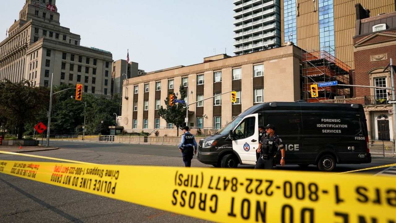 Toronto Police officers work at the scene of a shooting at the U.S. Consulate in Toronto, Ontario, Canada July 27, 2026. (Reuters/Arlyn McAdorey)