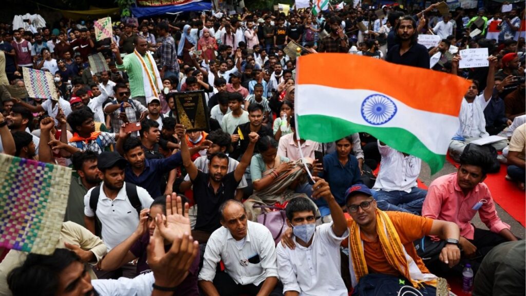 Supporters of India's Cockroach Janata Party (CJP) hold flags and signs during the ongoing protests, a few days after thousands of protesters marched towards parliament demanding the resignation of Education Minister Dharmendra Pradhan over National Eligibility cum Entrance Test (NEET) examination paper leaks, at Jantar Mantar in New Delhi, India, July 23, 2026. Reuters/Anushree Fadnavis