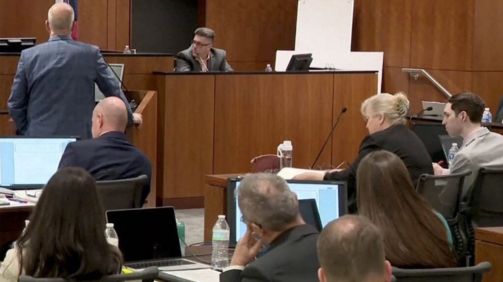 Tyler Robinson, the man accused of killing conservative activist Charlie Kirk, sits beside defense lawyer Kathryn Nester during a preliminary court hearing as Utah County prosecutor Chad Grunander questions David Hull, an investigator with the Utah Department of Safety, in Provo, Utah, U.S. July 6, 2026 in a still image from video. (Utah Courts and KSL TV/Pool via Reuters)