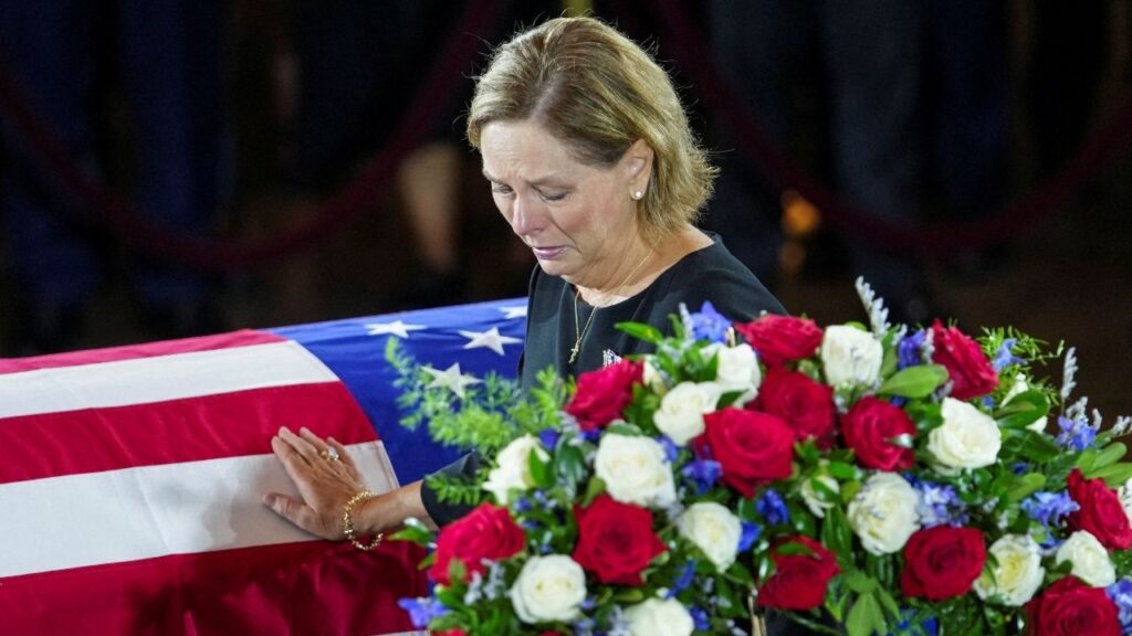 U.S. Senator Darline Graham (R-SC), sister of late U.S. Senator Lindsey Graham (R-SC), mourns by his casket, during a Congressional Tribute to late U.S. Senator Lindsey Graham (R-SC) at the Rotunda of the U.S. Capitol in Washington, D.C., U.S., July 28, 2026. REUTERS/Nathan Howard/Pool