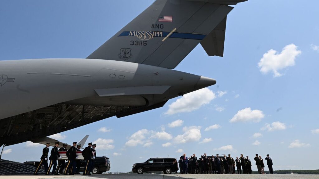 President Donald Trump and officials salute during a dignified transfer for soldiers killed amid the conflict with Iran at Dover Air Force Base in Delaware, on Wednesday, July 22, 2026. Nearly a dozen U.S. troops were wounded severely enough by Iranian missile and drone attacks in Jordan and other countries this month that they were flown to a U.S. military hospital in Germany for treatment, a U.S. military official said on Wednesday. (Kenny Holston/The New York Times)
