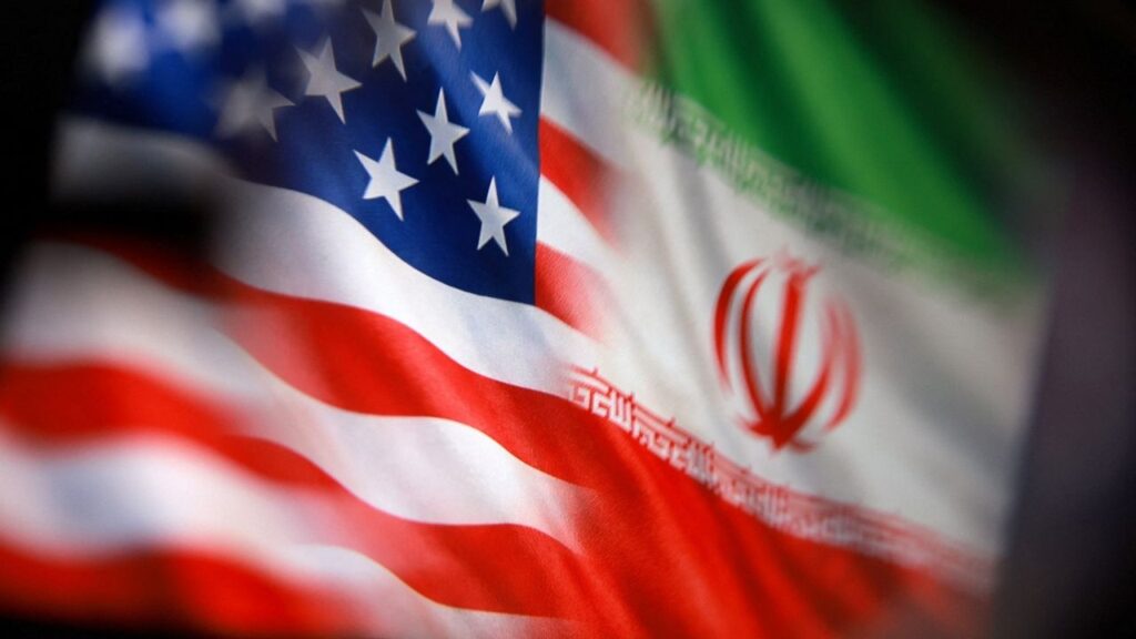 U.S. and Iranian flags are seen in this illustration taken March 23, 2026. REUTERS/Dado Ruvic/Illustration