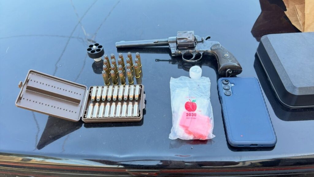 Visalia police arrested two people after a 911 hang-up call led officers to a residence where they found methamphetamine, suspected drug sales evidence, a firearm and ammunition during a parole search. (Visalia PD)