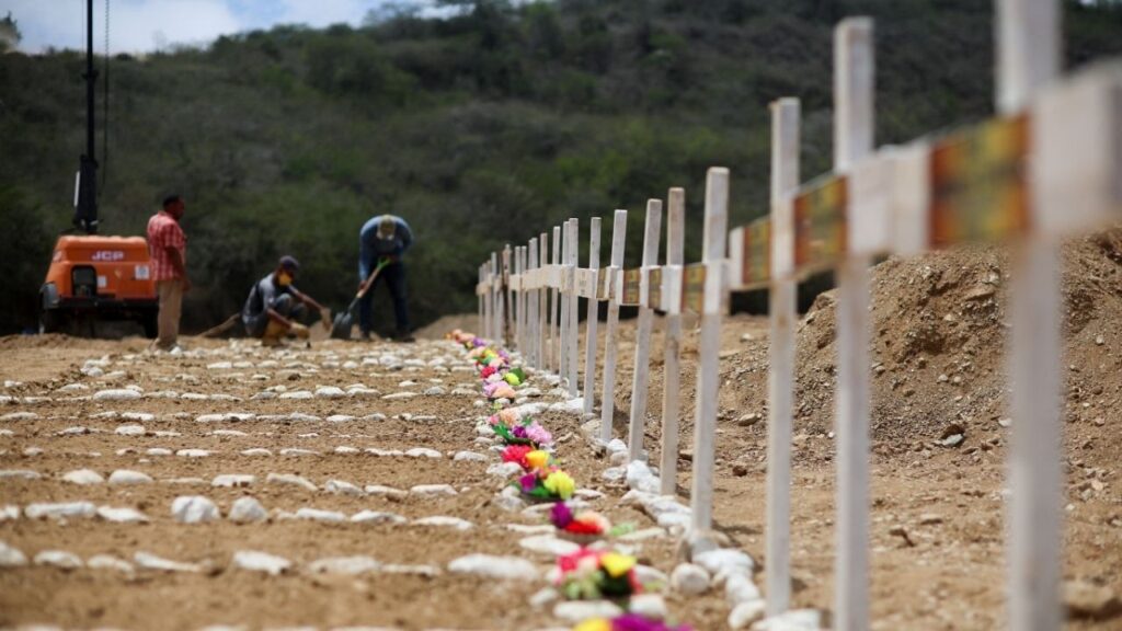 Workers prepare graves on the day of the burial of earthquake victims, in the aftermath of the June 24 earthquakes, at La Esperanza Cemetery, in La Guaira, Venezuela, July 6, 2026. REUTERS/Adriano Machado