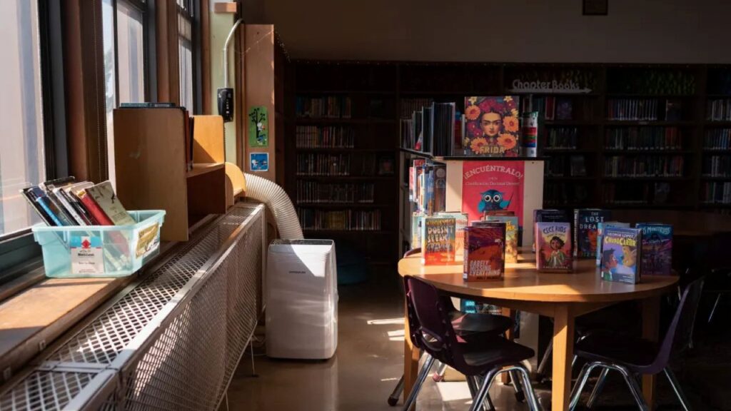 Image of a portable floor air conditioner in a school library