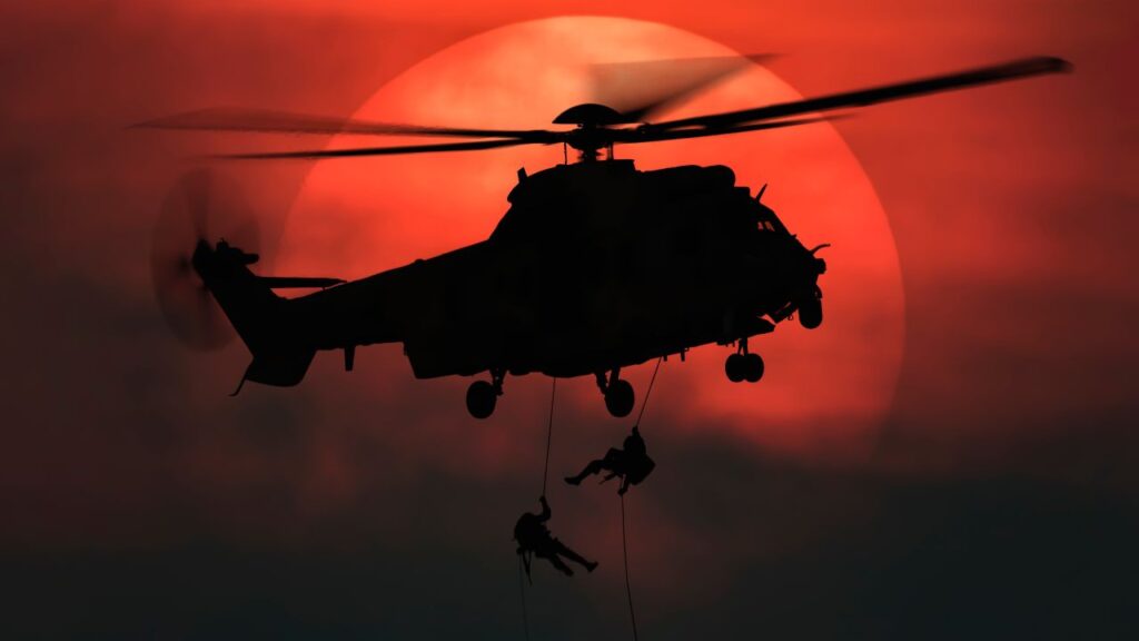 Image of a Blackhawk helicopter in front of the sun