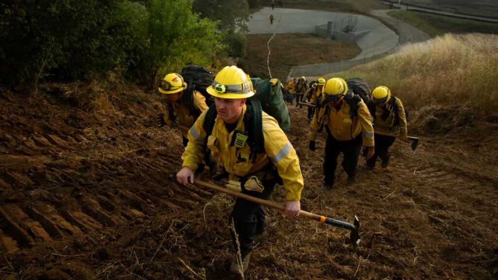 Image of firefighters marching up a hill