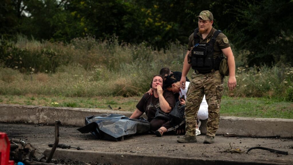 A woman mourns a relative who was killed in a guided aerial bomb strike on another gas station in Zaporizhzhia, Ukraine, on July 26, 2026. An attack on a different gas station by what Ukrainian officials said was a Russian drone with an Nvidia chip presages a dystopian future of weaponry untethered to humans. (Nicole Tung/The New York Times)