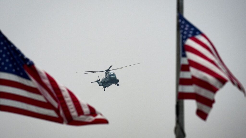 A Sikorsky VH-3D Sea King helicopter, operated by U.S. Marine Helicopter Squadron One (HMX-1), flies past U.S. flags at the base of the Washington Monument, as it arrives to transport U.S. President Donald Trump as Marine One, in Washington, D.C., U.S., July 17, 2026. (Reuters File)