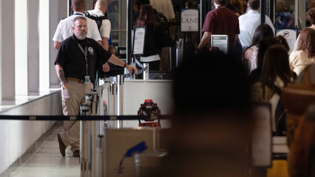 A U.S. Department of Homeland Security officer observes passengers at the George Bush Intercontinental Airport in Houston, Texas, U.S., March 25, 2026. (Reuters File)