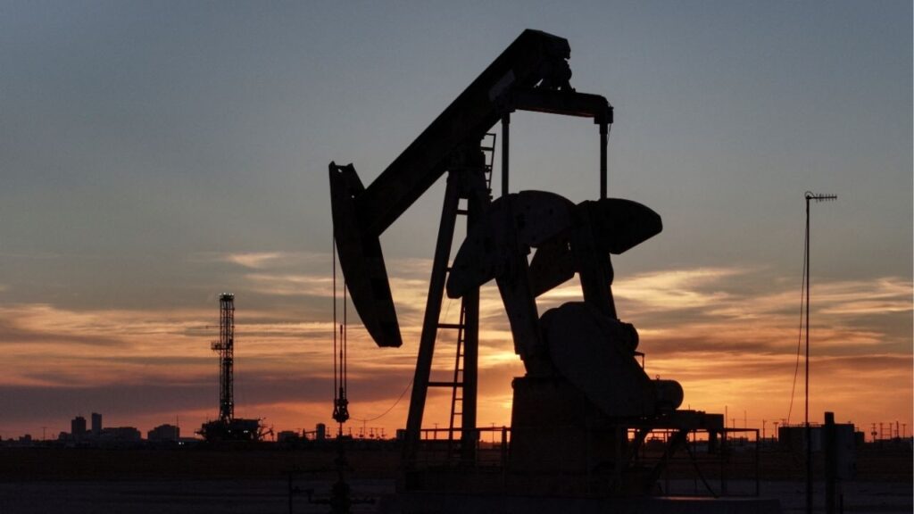 A drone view of a pump jack and drilling rig south of Midland, Texas, U.S. June 11, 2025. (Reuters/Eli Hartman)