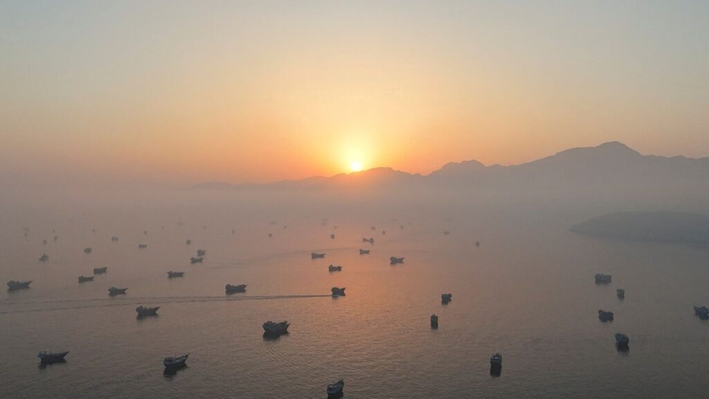 A drone view shows vessels in the Strait of Hormuz, as seen from Musandam, Oman, June 15, 2026. (Reuters File)