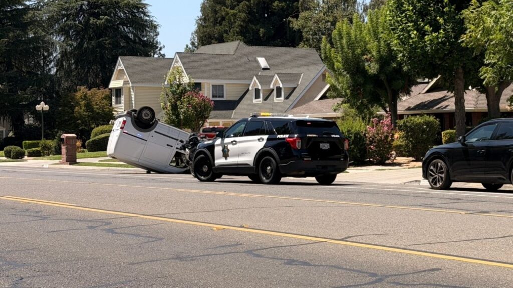 A male driver was uninjured after his vehicle struck a mailbox and overturned Thursday near Audubon Drive and Quincy Avenue, Fresno police said. (GV Wire/Eric Martinez)
