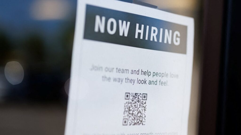 A "now hiring" sign is displayed on a local business after, U.S. employment growth slowed more than expected in July, in Encinitas, California, U.S. August 1, 2025. REUTERS/Mike Blake