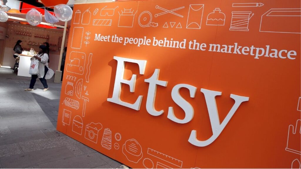 A sign advertising the online seller Etsy Inc. is seen outside the Nasdaq market site in Times Square in New York April 16, 2015. REUTERS/Mike Segar