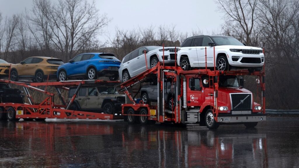 A truck transports finished vehicles from the Stellantis plant in Windsor, Canada, on Jan. 31, 2025. Canadian officials headed back to Washington on Thursday, Aug. 20, 2026, for another round of talks, in an effort to avert damaging new tariffs set to take effect on Saturday, Aug. 22, 2026, and preserve Canada’s biggest trade relationship. (Ian Willms/The New York Times)