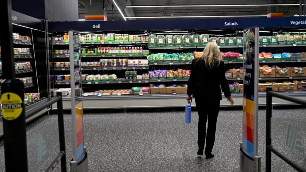 A woman walks near food on display in an Aldi grocery store in New York City, U.S. June 17, 2026. (Reuters File)