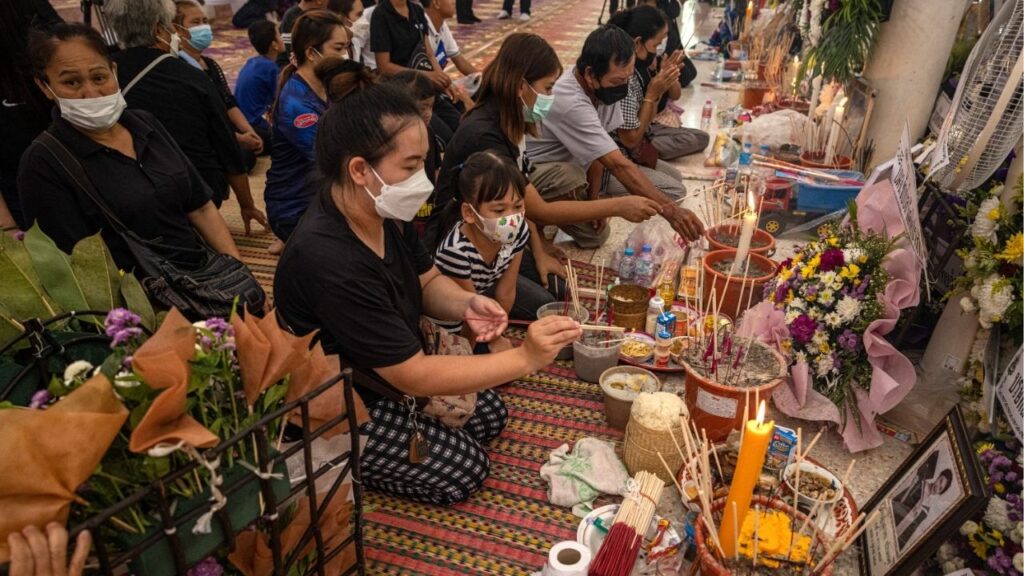 Mourners at Wat Rat Samakee, a temple in Uthai Sawan, Thailand, on Oct. 8, 2022, after a mass shooting. A rampage at a high school in Thailand on Friday, Aug. 7, 2026, was the latest episode of gun violence in a country that has grappled in recent years with several attacks. (Andre Malerba/The New York Times)