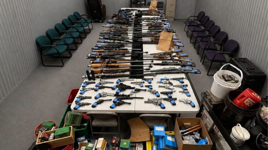 Authorities say a multi-agency task force seized more than 100 firearms, about 55,000 rounds of ammunition, two silencers and evidence of illegal firearm manufacturing from a Strathmore home. (Visalia PD)