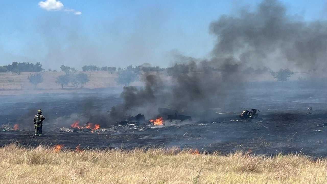 Emergency personnel respond to the crash of an AH-64 Apache military helicopter, attached to the U.S. Army base of Fort Hood, near Salado, Texas, U.S. August 12, 2026. Picture taken with a mobile phone. Cliff Coleman/Bell County Sheriff's Office/Handout via REUTERS