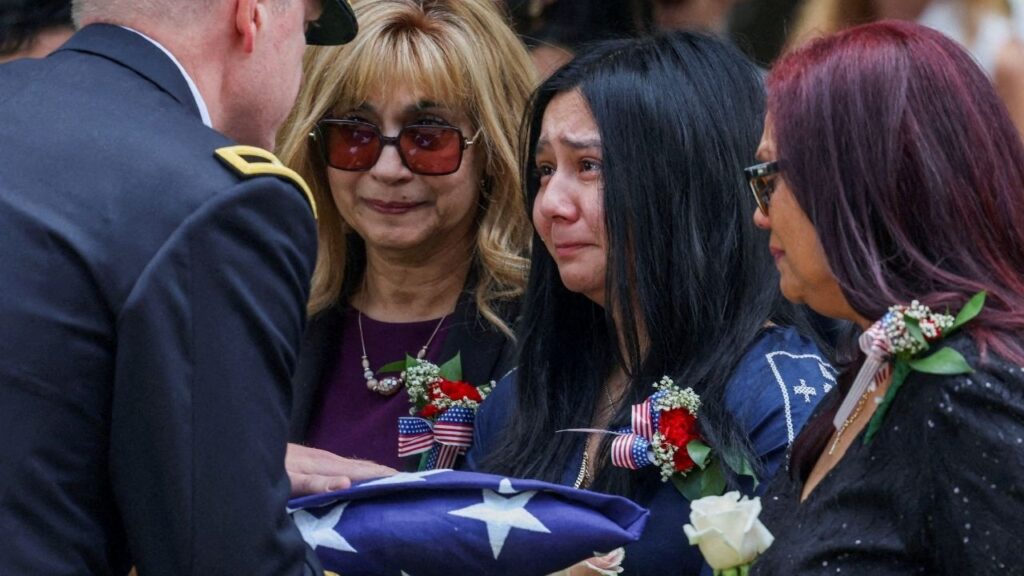 Family members are presented with a flag during the burial service for U.S. soldier Sgt. Angel S. Rampersad, who was killed in an attack on Muwaffaq Salti Air Base in Jordan, at the Long Island National Cemetery, in New York, U.S., July 31, 2026. (Reuters File)