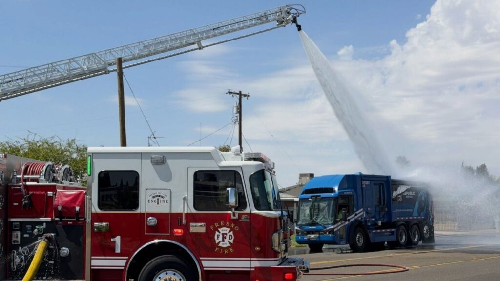 Fresno firefighters are working to extinguish an electric garbage truck fire on Winery Avenue that may have been sparked by a lithium-ion battery discarded in a waste receptacle. (Fresno FD)