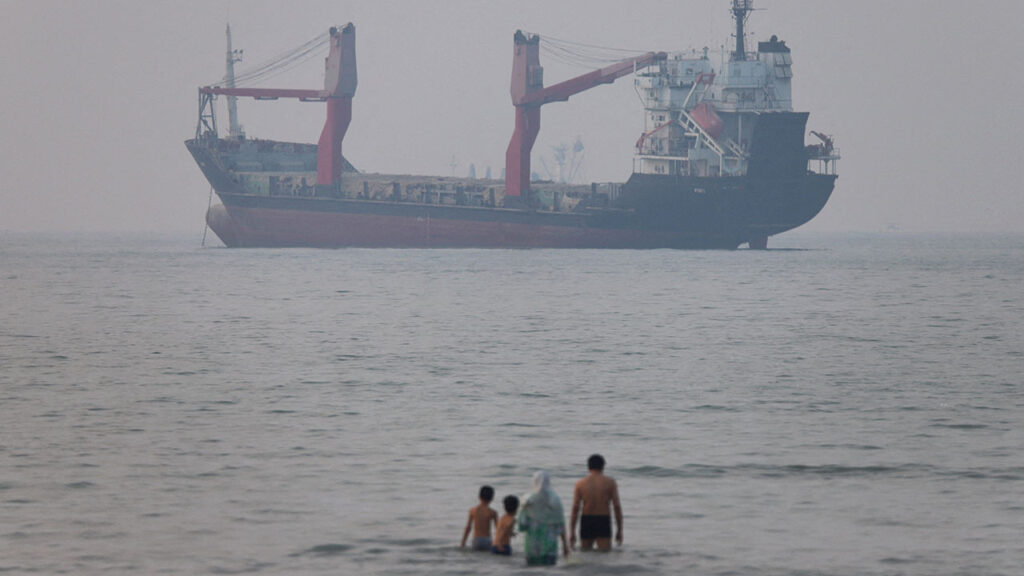 A vessel in the Strait of Hormuz near the beach of Bandar Abbas, Iran, June 30, 2026. (Amirhosein Khorgooi/ISNA/via WANA (West Asia News Agency)via Reuters)