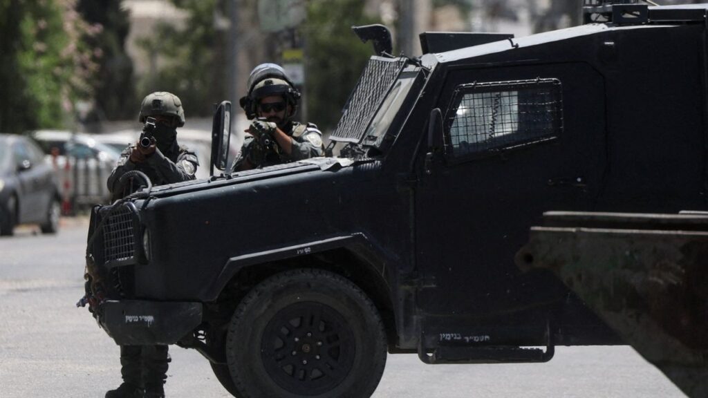 Israeli forces point their weapons as they take part in a raid in Qalandia refugee camp, in the Israeli-occupied West Bank, August 25, 2026. (Reuters File)