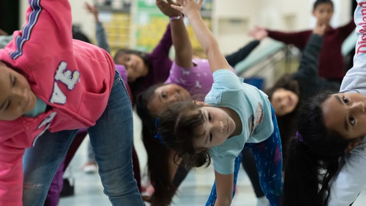 Kindergarten students participate in a hip-hop dance class at Radcliff Elementary School in Watsonville on May 21, 2024. Photo by Laure Andrillon for CalMatters
