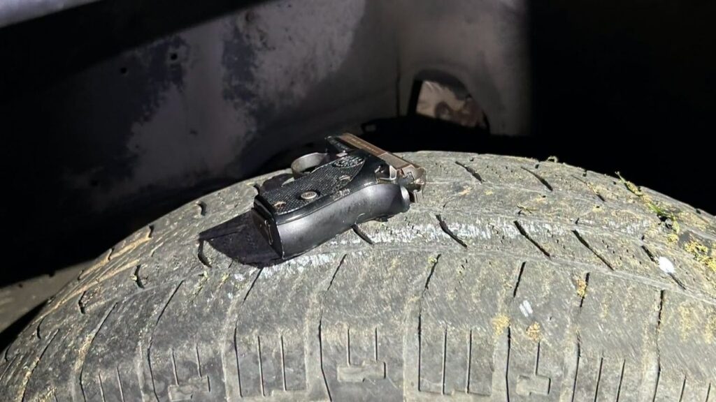 Madera police arrested Daniel Ocampo, 23, and Gerardo Alavez Gomez, 19, on firearm, fighting and gang-related charges after officers found a gun on top of a tire of their vehicle. (Madera PD)