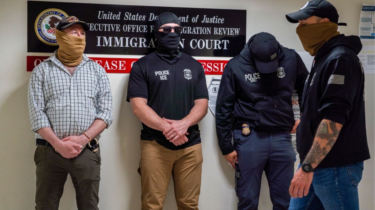 Masked federal immigration officers stand outside an immigration court at 26 Federal Plaza in New York, May 15, 2026. New York’s law prohibiting federal immigration agents from wearing masks and requiring them to display identification was blocked on Monday, Aug. 3, 2026, after a federal judge issued a preliminary injunction halting the ban. (Madison Swart/The New York Times)