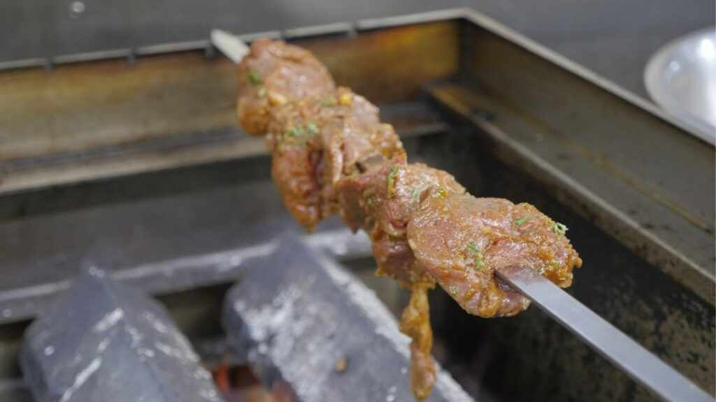 Meat being prepared at Lily's Mediterranean Cuisine. (GV Wire/Jahz Tello)
