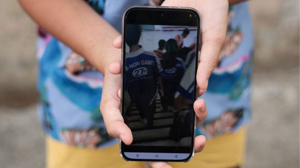 Khim, a 14-year-old eighth-grade student at Debsirin Nonthaburi School, shows footage she recorded during evacuation, during an exclusive interview with Reuters about what she saw and witnessed during the shooting incident at the school, a day after the incident, in Bang Kruai district, Nonthaburi province, on the outskirts of Bangkok, Thailand, August 8, 2026. Reuters/Chalinee Thirasupa
