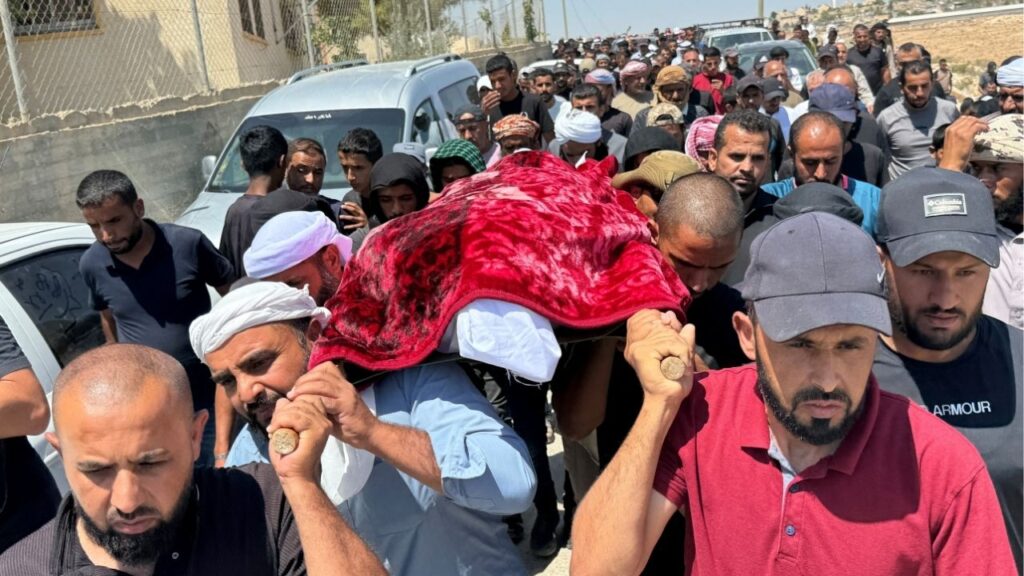 Mourners carry the body of well-known Palestinian activist Owdeh Hathaleen, who, according to people who said they witnessed the shooting, was shot and killed in the village of Umm al-Khair by Israeli settler last week, during his funeral near the city of Hebron in the Israeli-occupied West Bank August 7, 2025. (Reuters File)