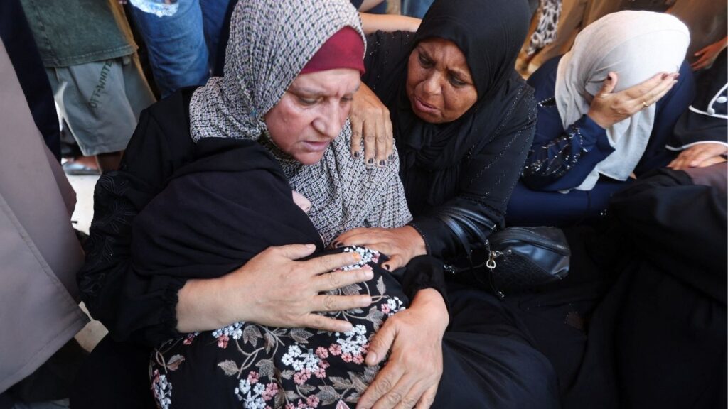 Mourners react at the funeral of a Palestinian man Huthaifa Kawari, who was killed in an Israeli strike, according to medics, at Nasser Hospital in Khan Younis, in the southern Gaza Strip, August 13, 2026. (Reuters/Ramadan Abed)