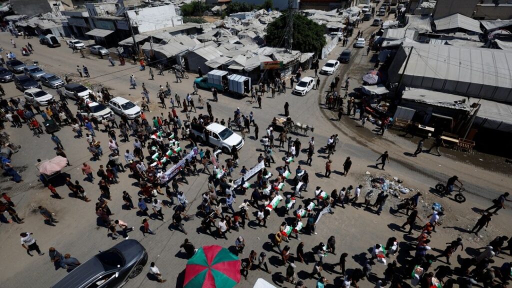 Palestinians attend the funeral of 50 people from three families killed during the war and whose bodies were retrieved from under the rubble recently, in Gaza City, August 20, 2026. (Reuters/Mahmoud Issa)