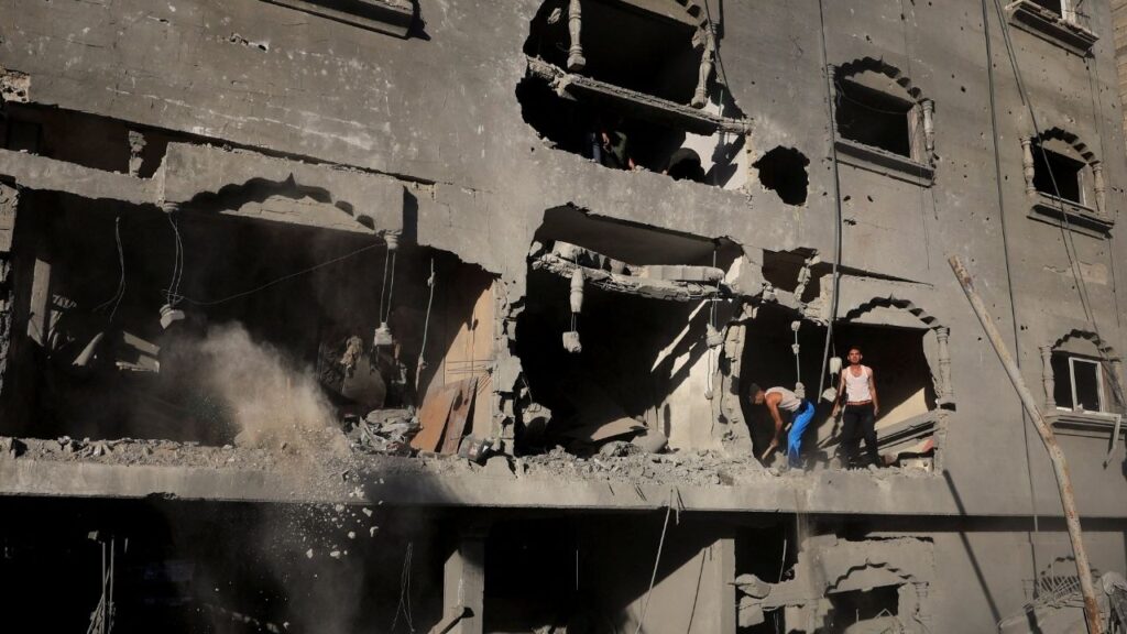 Palestinians inspect the site of an Israeli strike on a house, carried out after the Israeli military warned residents to evacuate the area, at al-Shati (Beach) refugee camp, in Gaza City, August 24, 2026. REUTERS/Dawoud Abu Alkas